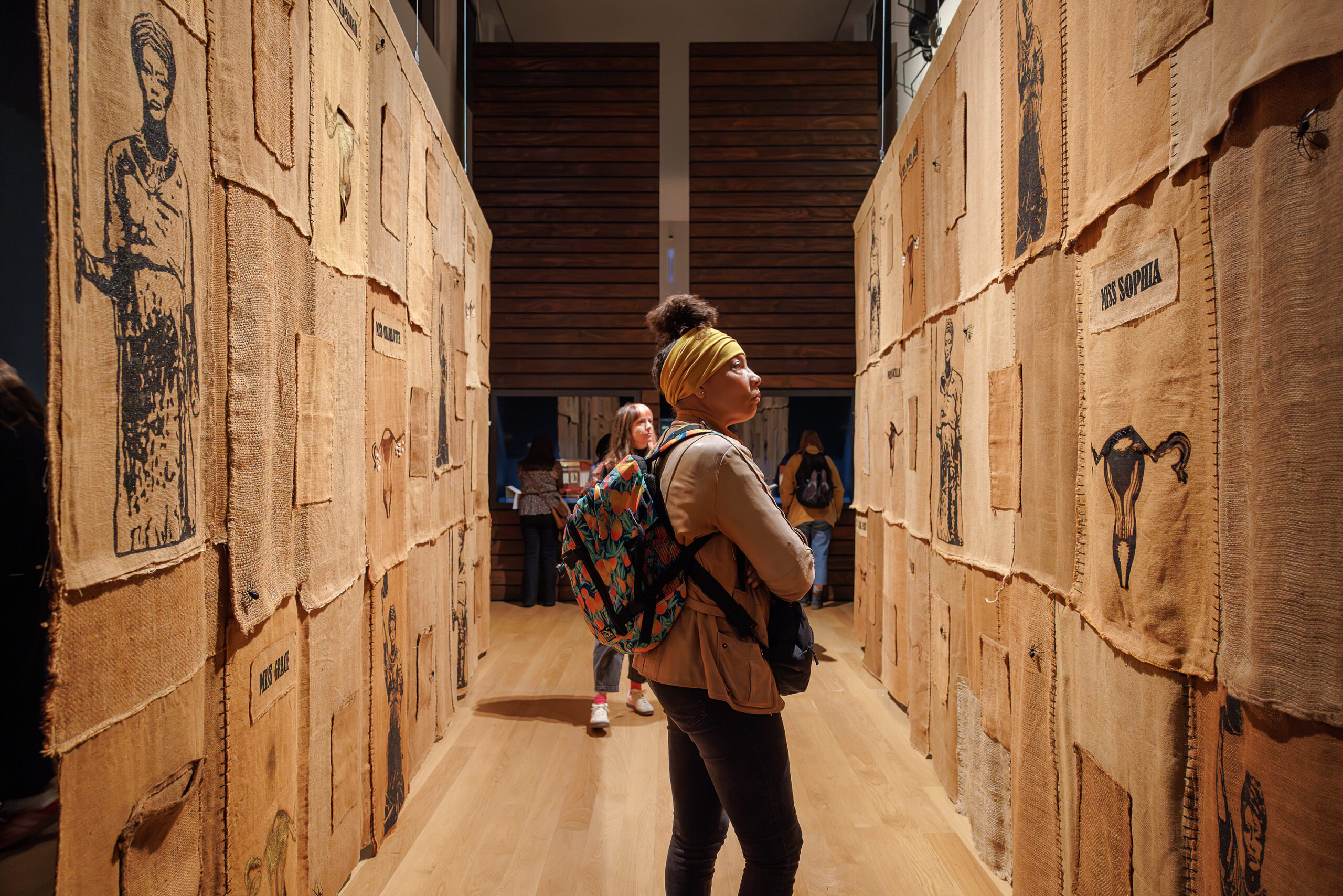 A woman looking at a museum exhibition