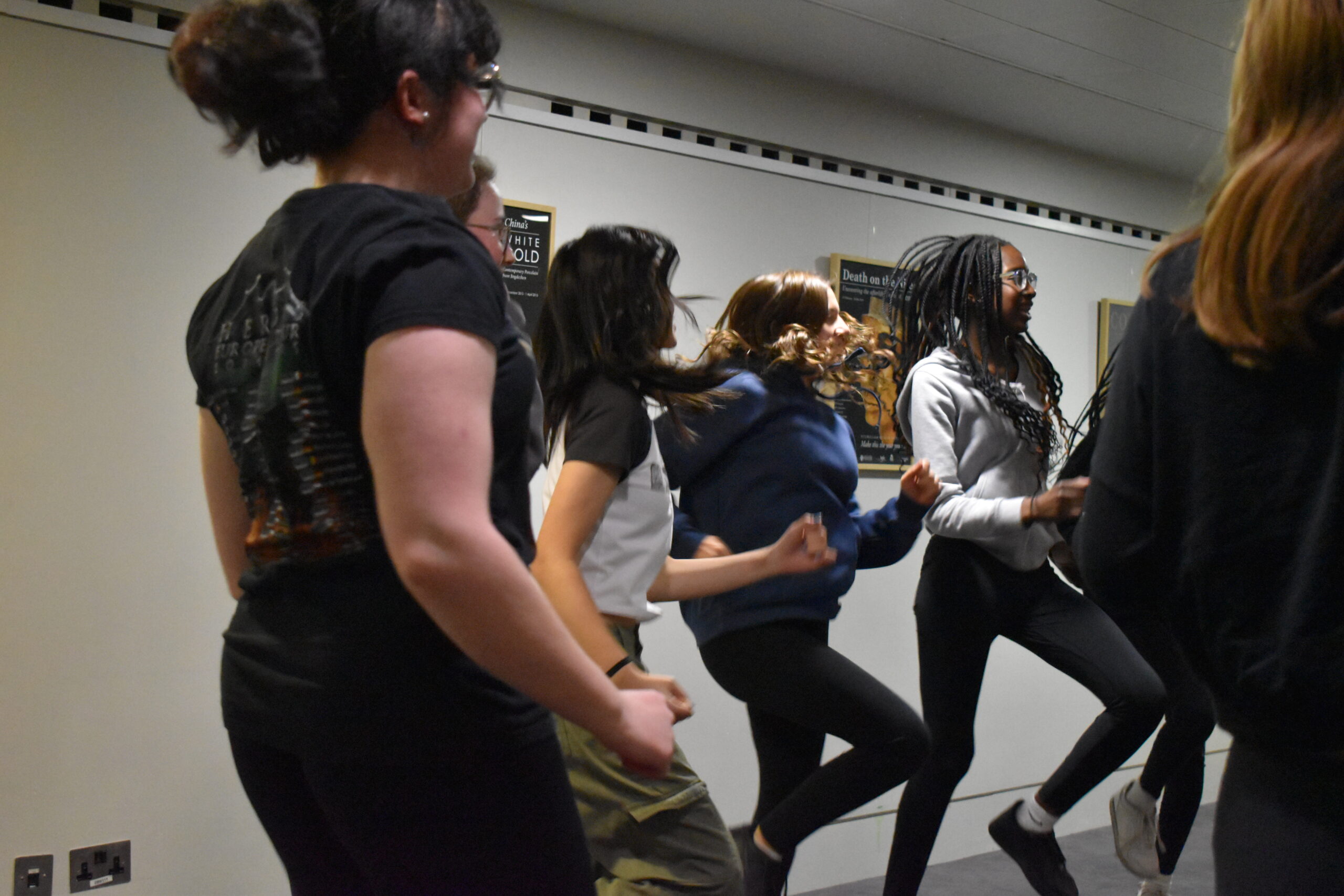 Students devising a physical theatre piece 