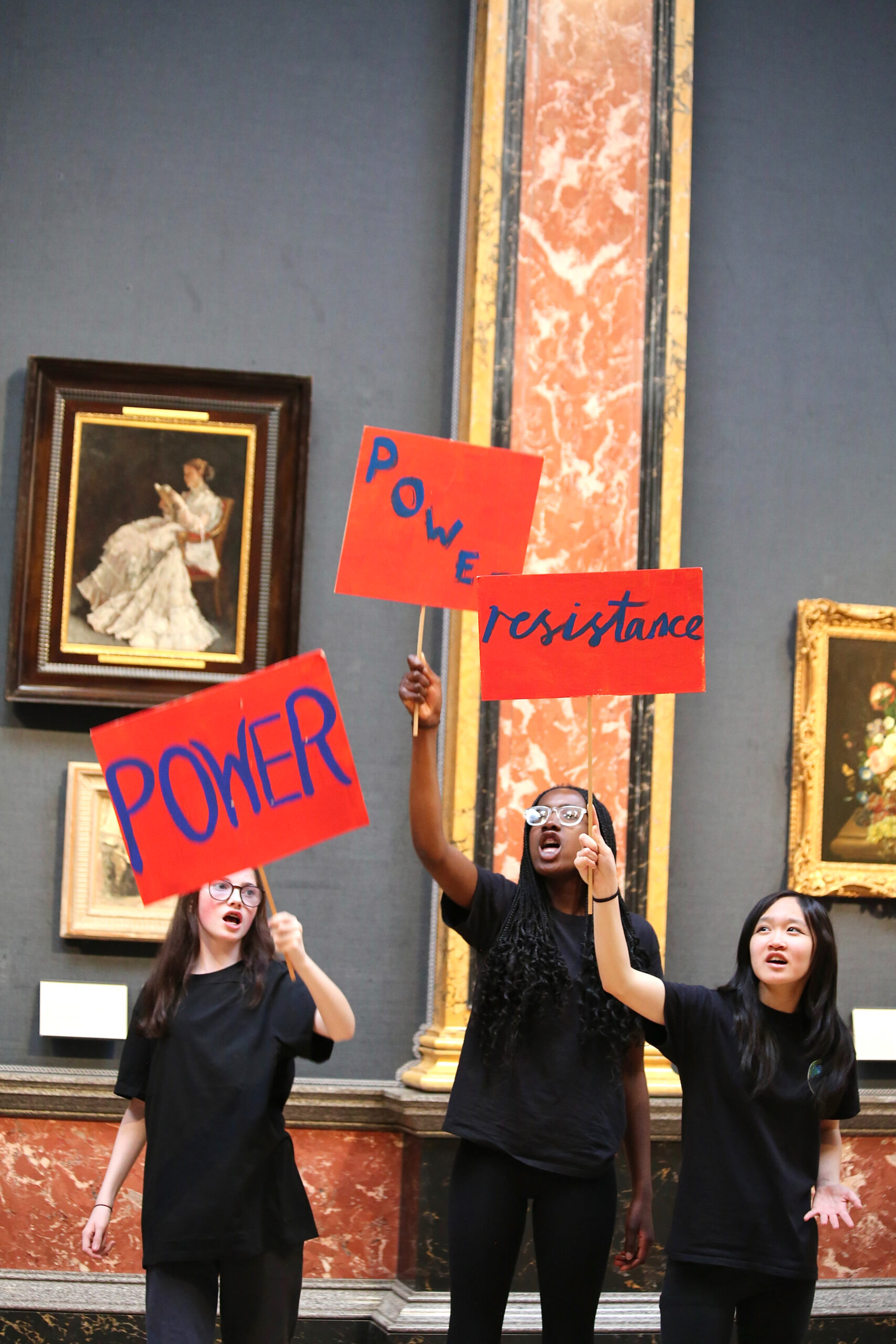 Student holding up signs 